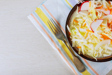 Wall Mural - fresh salad with cucumber,carrots and cabbage