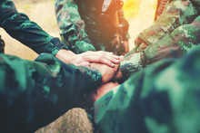 Teamwork Concept : Group Of Soldier Hands Together Cross Processing Ready To Fight.