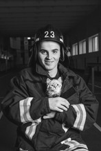 The Fireman Is Holding A Kitten 