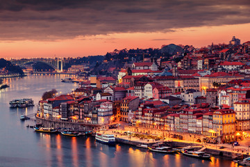 View to Porto over river Douro with reflection of the lights at night