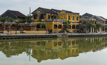 Old Town Of Hoi An Golden Buildings Reflected In The River 