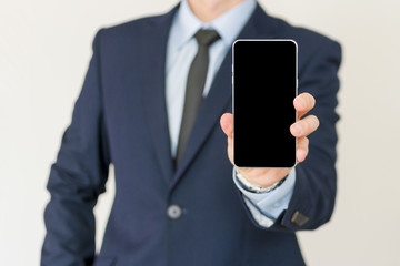 businessman show his smart phone, smart phone in the hand