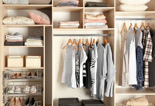 Fotografía Large wardrobe closet with different clothes and shoes