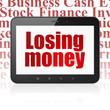 © Maksim Kabakou - Money concept: Tablet Computer with  red text Losing Money on display,  Tag Cloud background, 3D rendering