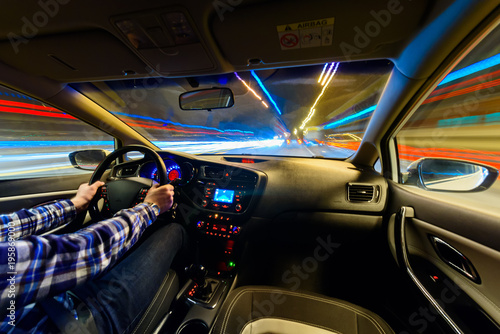 Poster Driving in night scenery, hands on steering wheel, night rain time