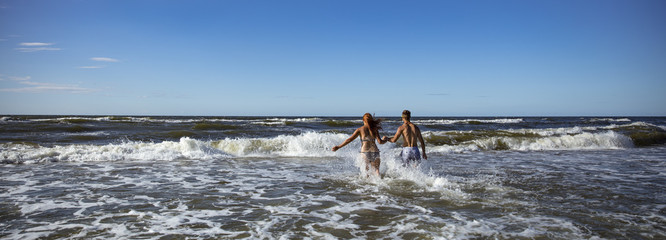 Wall Mural - two lovers on beach and summer time 