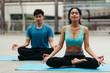 © smilepoker - peoples do yoga and relaxation in city. Vital and meditation for fitness lifestyle outdoor. Concept Yoga