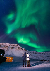 Wall Mural - the polar arctic northern lights aurora borealis sky star in norway svalbard in longyearbyen city ma