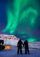 Wall Mural - the polar arctic northern lights aurora borealis sky star in norway svalbard in longyearbyen city ma