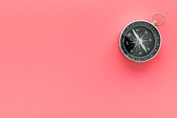 Wall Mural - Compass on pink background top view copy space