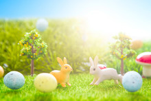 Easter Rabbits Toy On Spring Green Grass. Fairy Tale