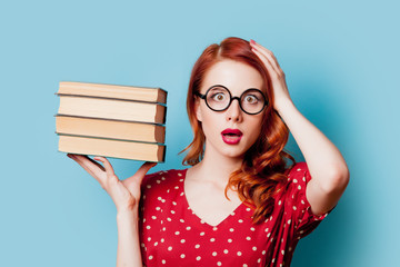 Wall Mural - Girl in red with books