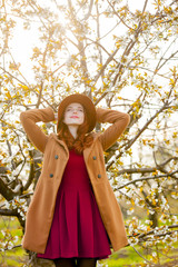 Sticker - girl in red clothes in blossom cherry garden