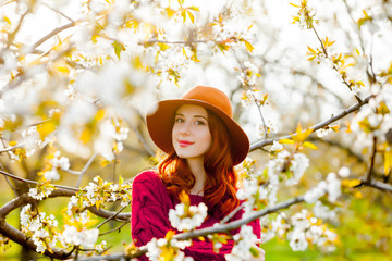 Sticker - girl in red clothes in blossom cherry garden