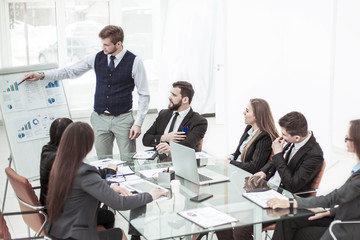 business team discussing the presentation of a new financial project on a workplace at office