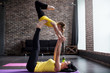 © undrey - Mother and daughterdoing gymnastic exercises together at home