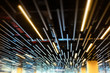 Fluorescent lamps line in modern building ceiling