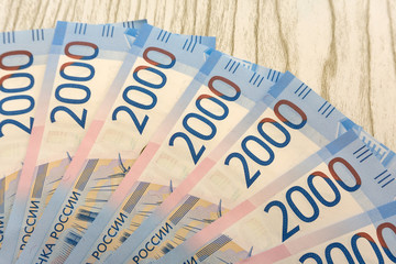 background of the new banknotes worth 2000 rubles .