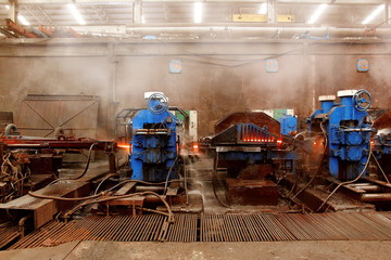 Wall Mural - The machine rolled steel in smelting steel plant.