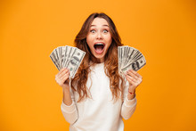 Surprised Screaming Brunette Woman In Sweater Holding Money