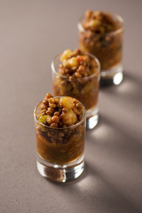 Poster - vegetarian stewed lentils in shot glasses