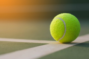 Wall Mural - Close up tennis ball on the courts background