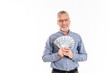 © Drobot Dean - Cheerful man smiling to camera while holding dollars isolated