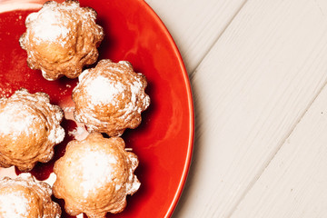 Delicious sweet cupcakes on red plate, delicious homemade dessert