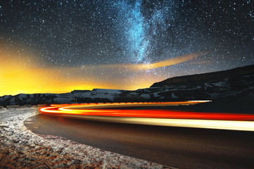 night landscape. night sky with a north hemisphere milky way and stars. the night road illuminated b