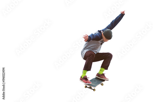Tela A teenager skateboarder jumps an ollie on an isolated white background
