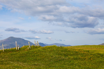 Wall Mural - Ireland spring landscape with the clouds on the blue sky