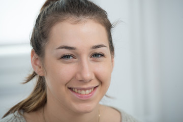 Poster - portrait of beautiful and smiling young woman