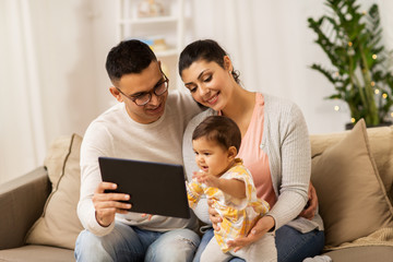 Wall Mural - mother, father and baby with tablet pc at home