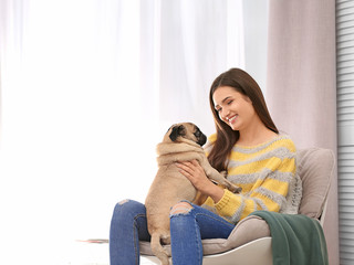 Canvas Print - Woman with cute dog at home. Friendship between pet and owner