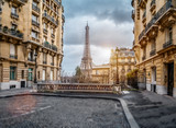Fototapeta Paryż - The eifel tower in Paris from a tiny street