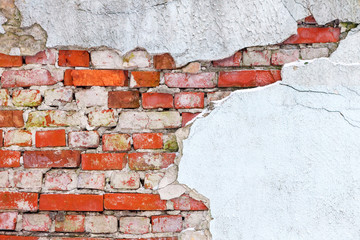 Wall Mural - Old wall of red brick with loose plaster.