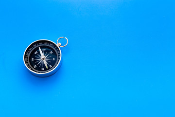 Wall Mural - Direction concept with compass on blue background top view mockup