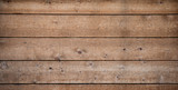 Fototapeta Desenie - A wooden plank wall for a texture and patterned background.