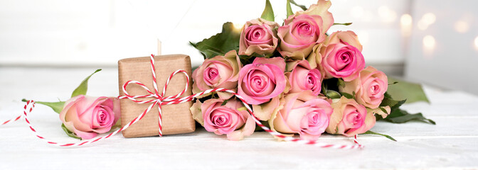 Mothers day still life with a gift and pink roses