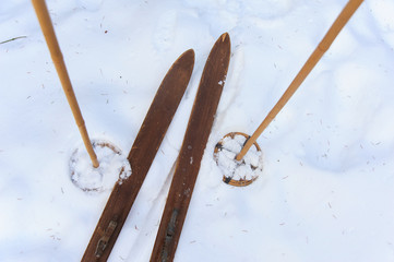 Photo of vintage old wooden skis on the terrace of a country house