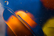 Oil drops on water surface abstract background
