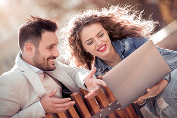 Wall Mural - Happy couple browsing together