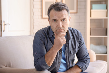 Wall Mural - Portrait of serious male pensioner at home