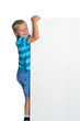 © lotosfoto - A little boy is looking from behind an empty banner.