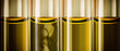 yellow liquid machine oil in glass tubes