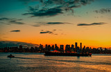 Fototapeta Nowy Jork - modern night city against a background of an orange red cloudy