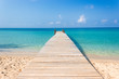 Wooden bridge on the tropical beach and blue sky