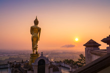 Golden Buddha Statue Beyond Nan City In The Morning, Thailand