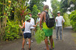 Cook Islander explains Western tourists about the local nature of Rarotonga Cook Island on Eco tourism tour
