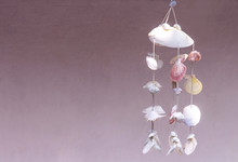 Seashells Hanging On White Background. Seashell Mobile Is Handicrafts Produced By Handmade.